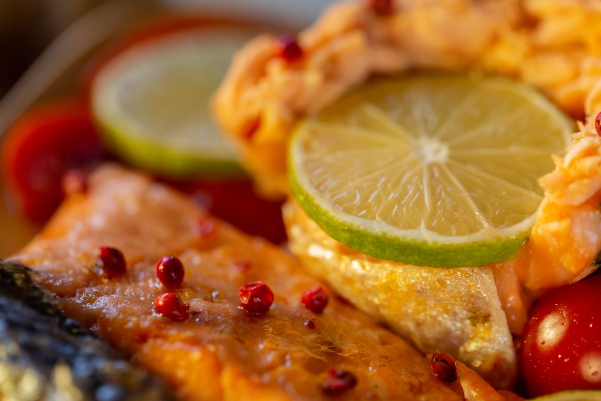 Salmon trout fillets with pink pepper and lime