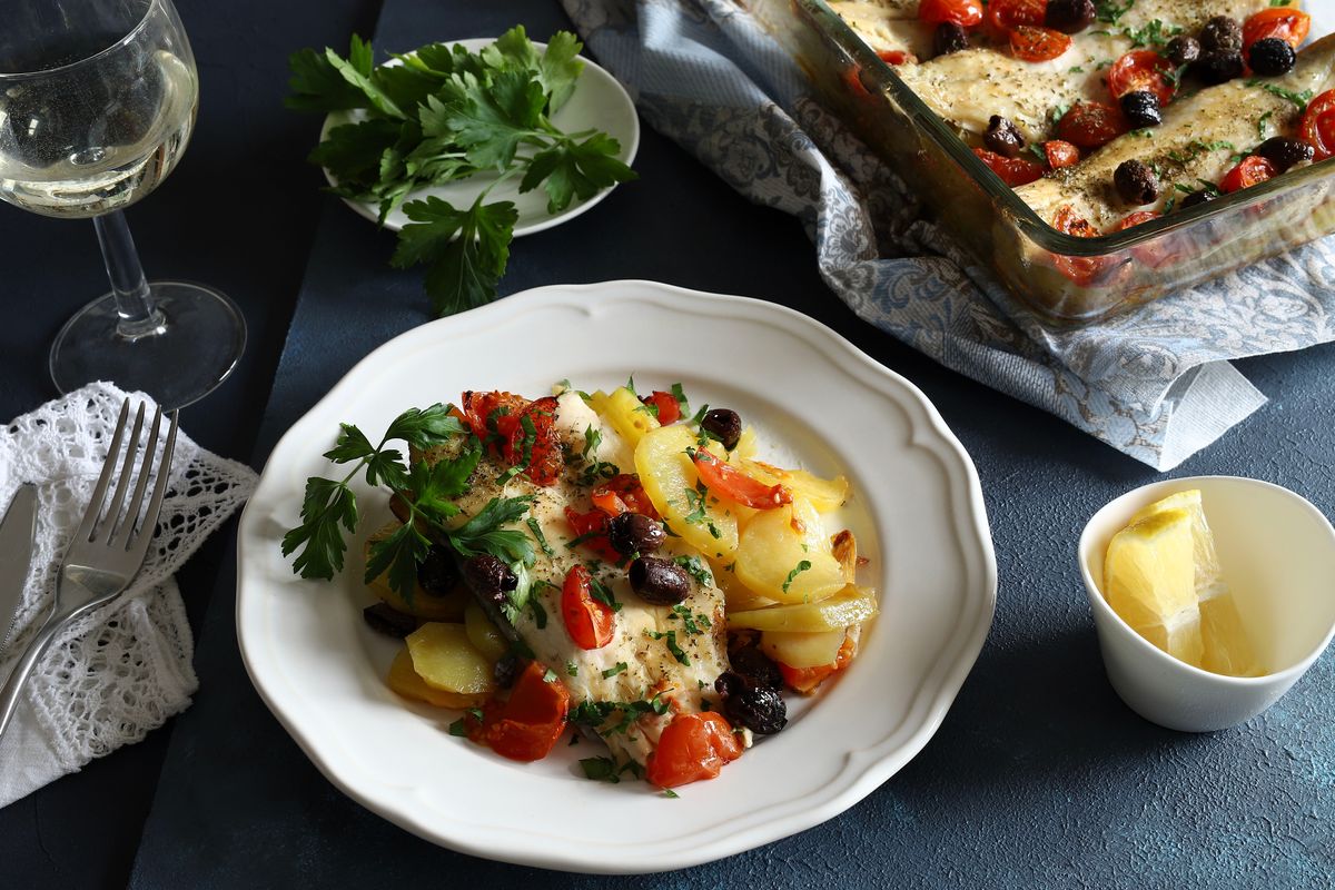 Baked hake with tomatoes and olives