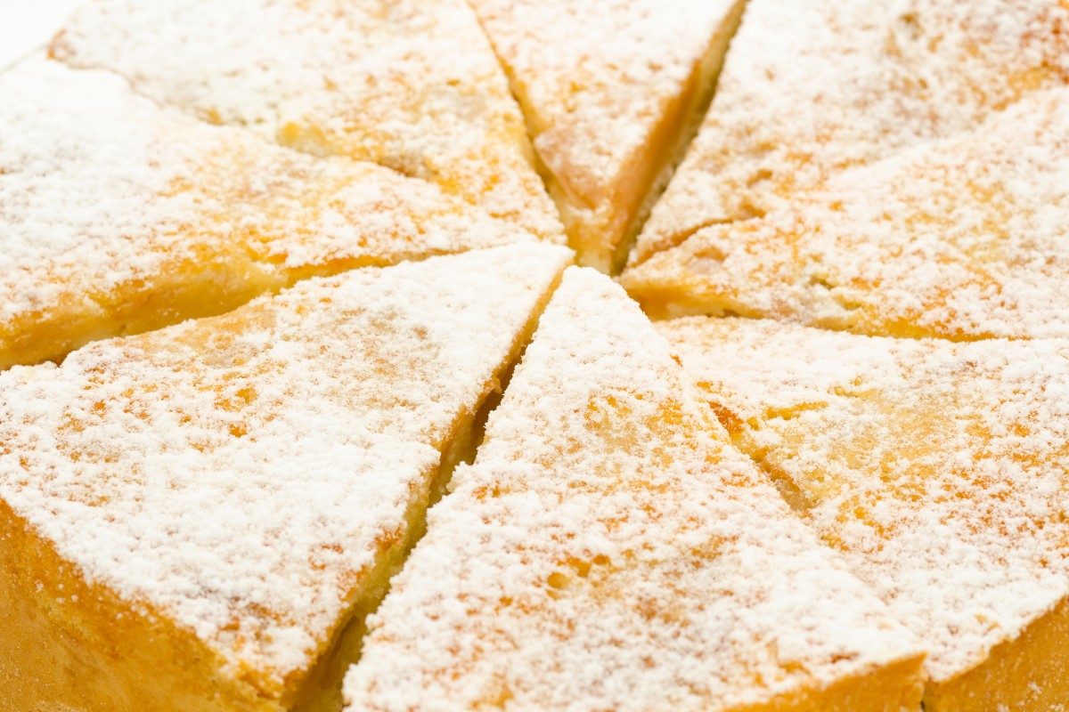 Water cake cut into slices decorated with icing sugar