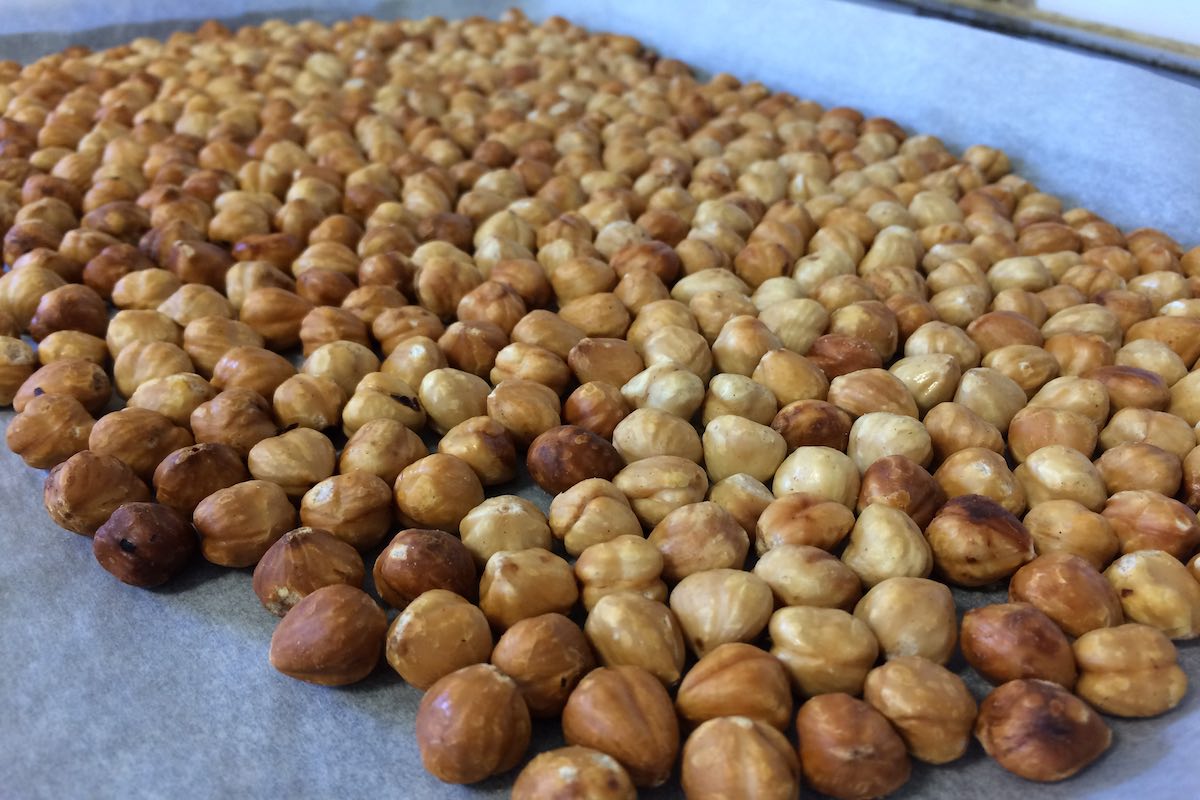 Toast the hazelnuts in the oven