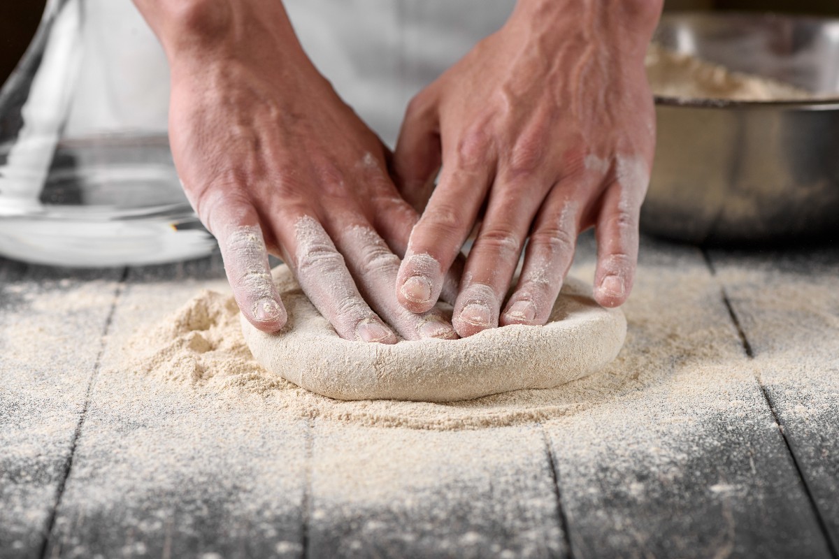 Rolling out Bonci pizza dough