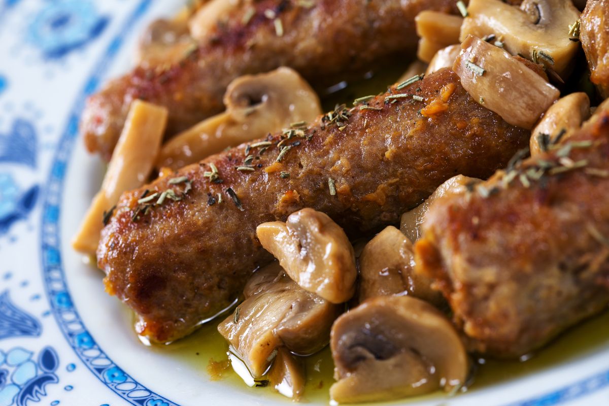 Sausage and mushrooms in a pan