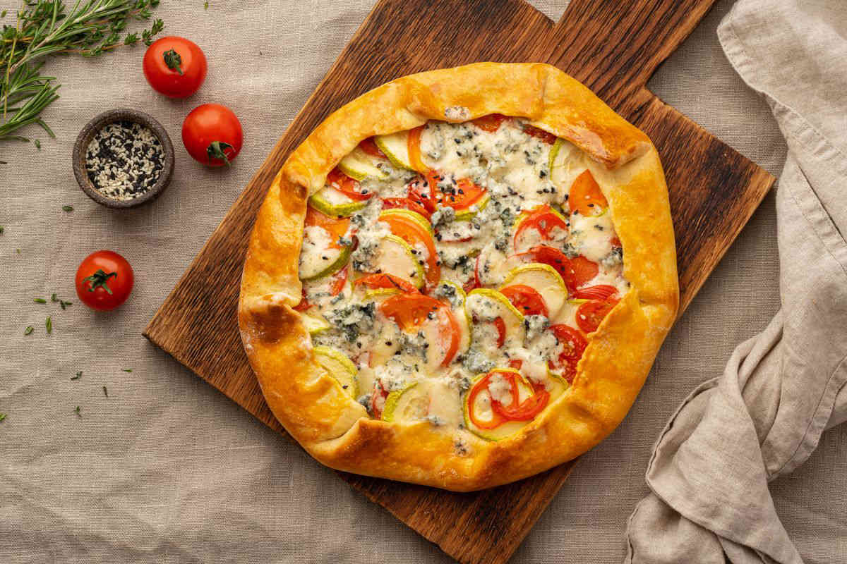 Savory pie with zucchini and cherry tomatoes