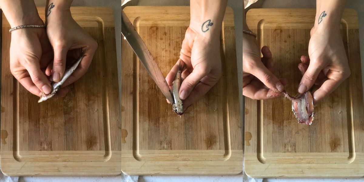 Cleaning sardines for pasta