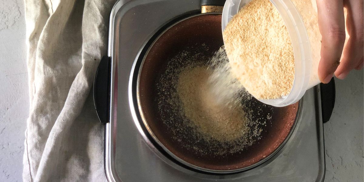 Toast breadcrumbs in a pan
