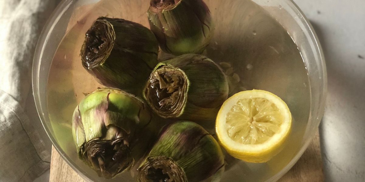 Soak the artichokes