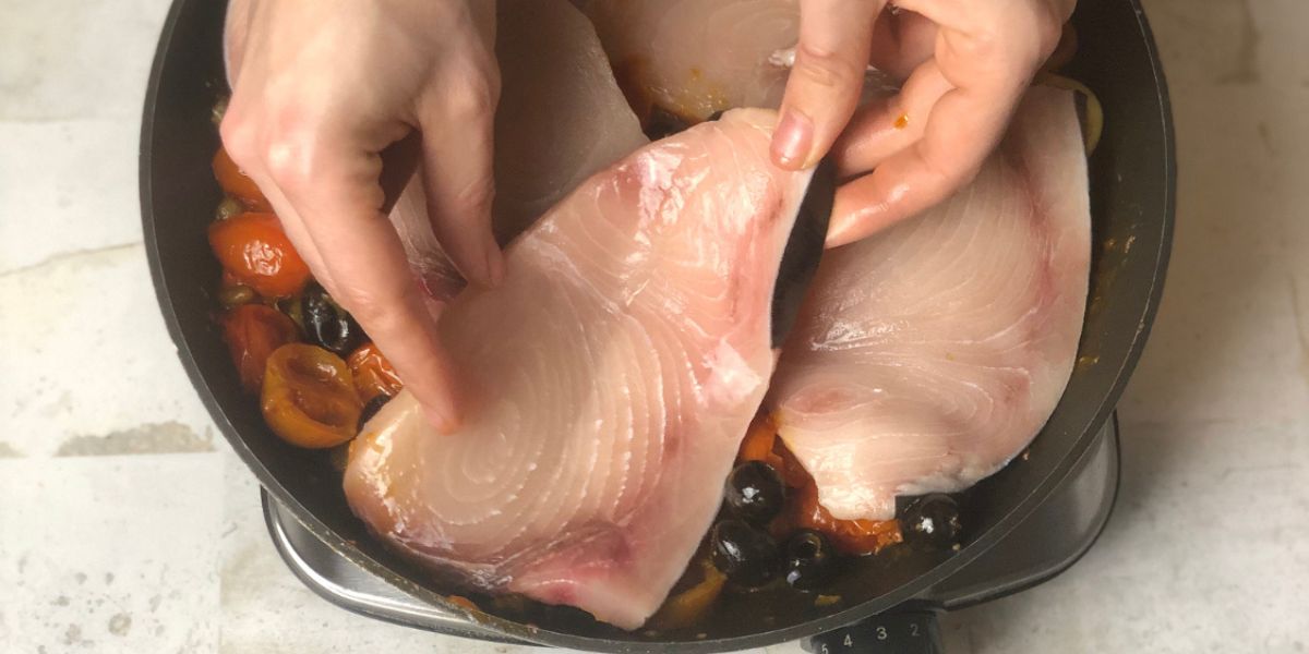 Add swordfish to the sauce