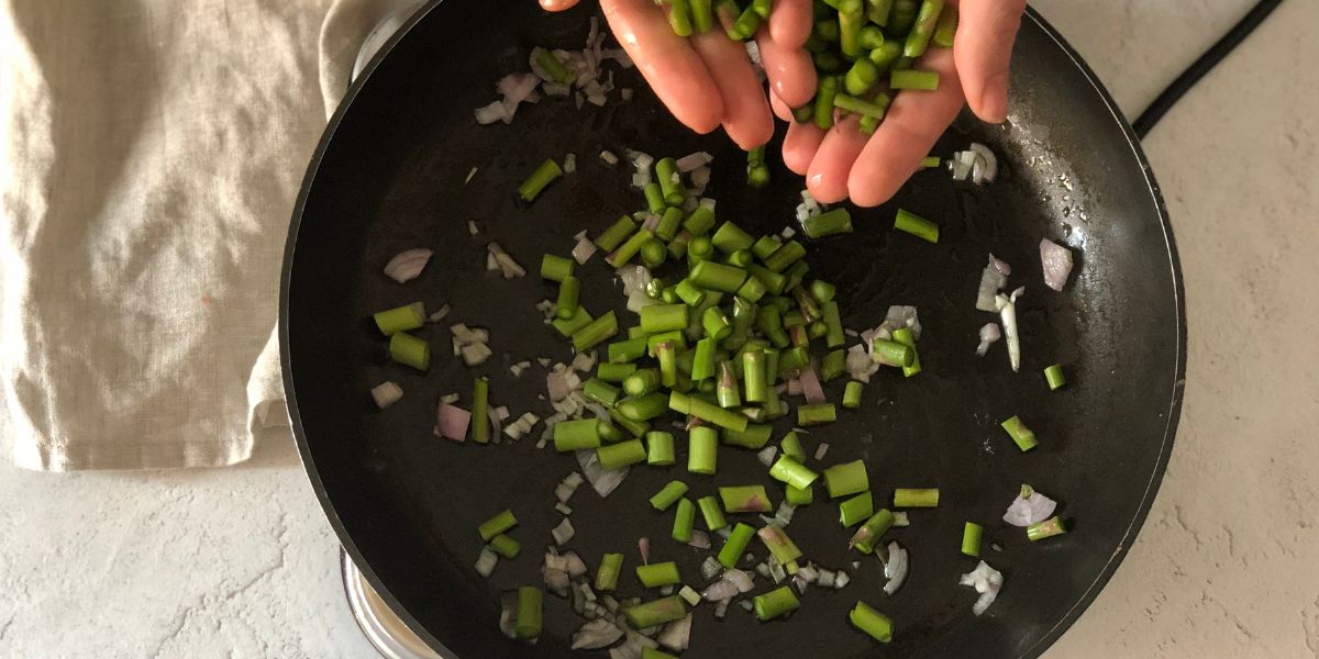 Cook asparagus in a pan
