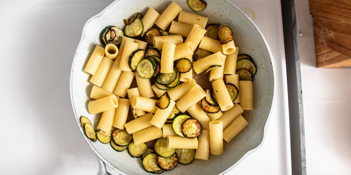 Drain pasta in pan with zucchini
