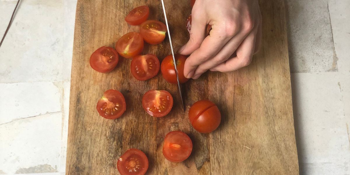 Cut cherry tomatoes for Sicilian swordfish