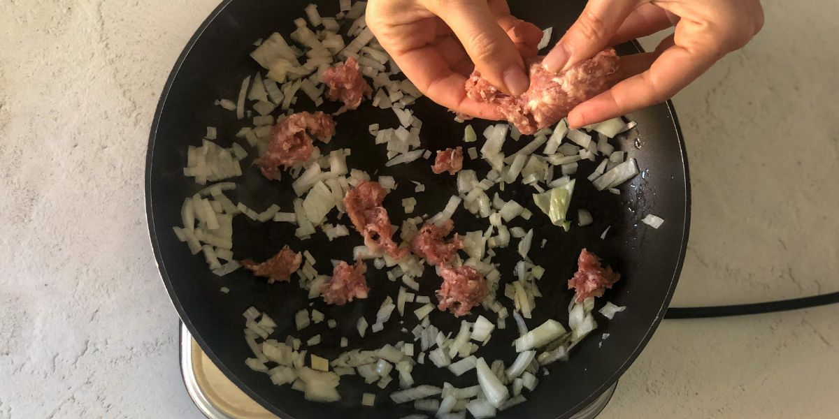 Cook sausage in gravy pan with zucchini