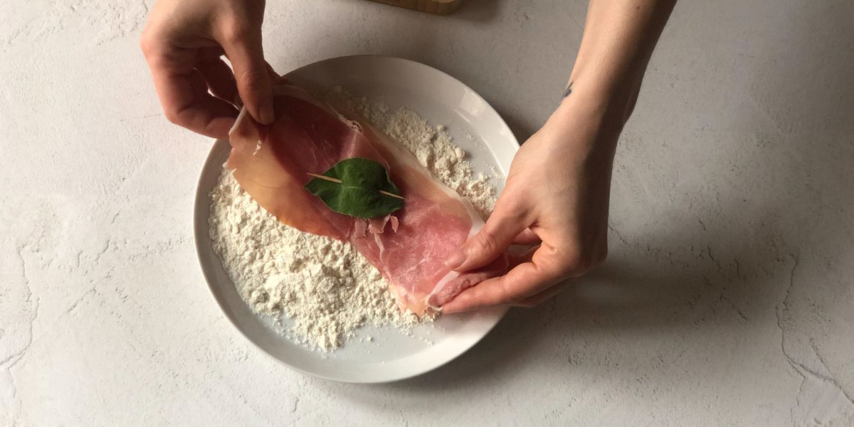 Coat the slices of meat with breadcrumbs