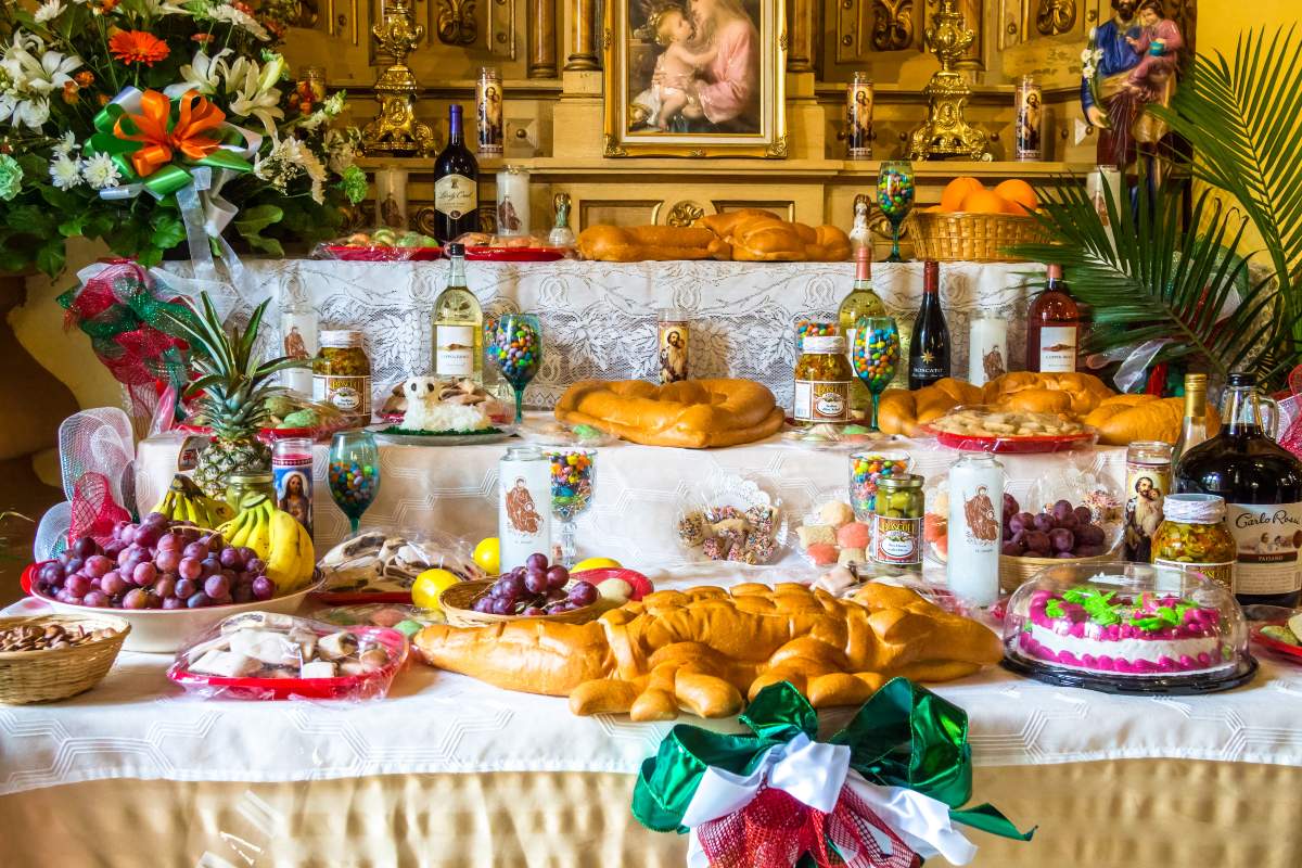 Altar dedicated to San Giuseppe with three floors filled with decorated bread and other Sicilian delicacies.