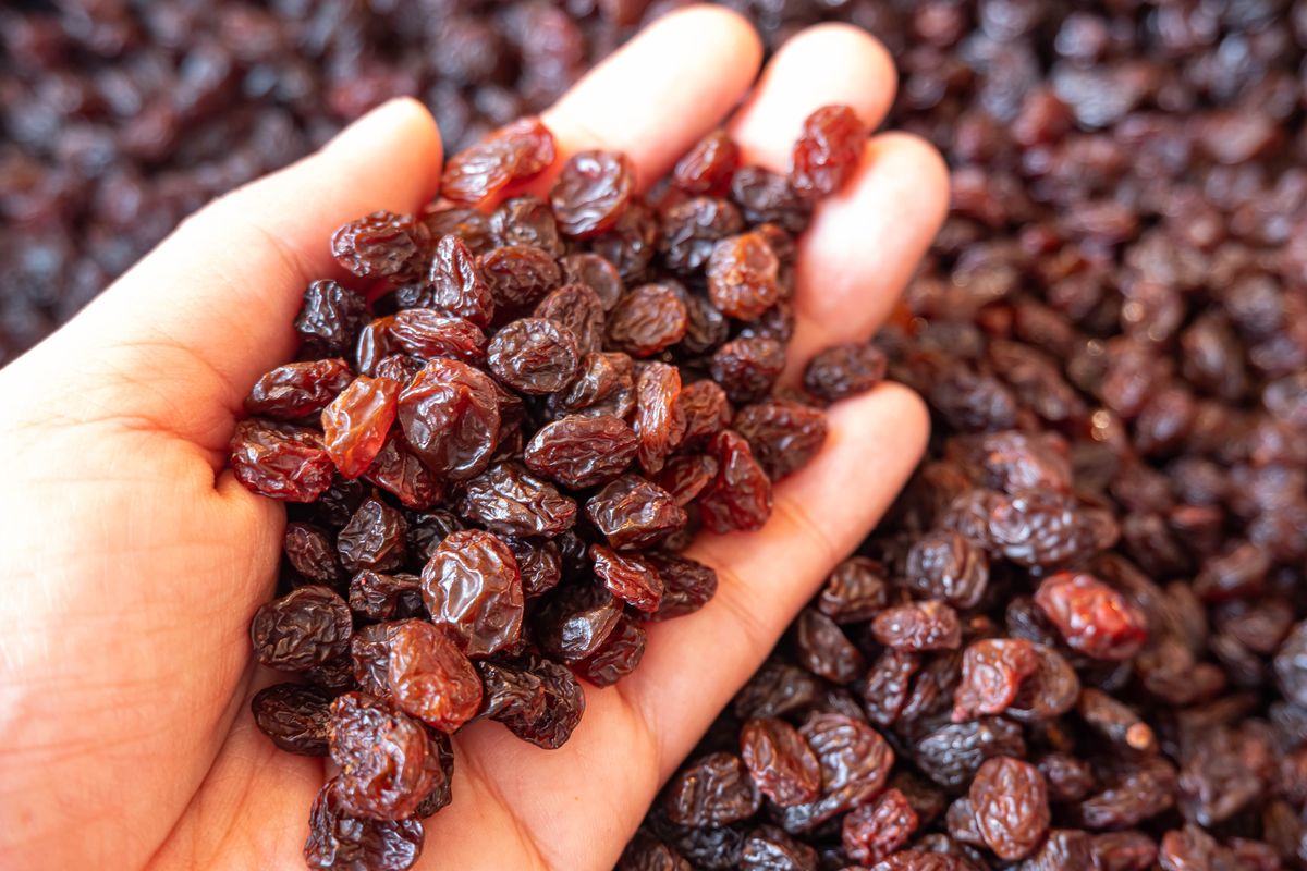 Top view hand picking sultanas