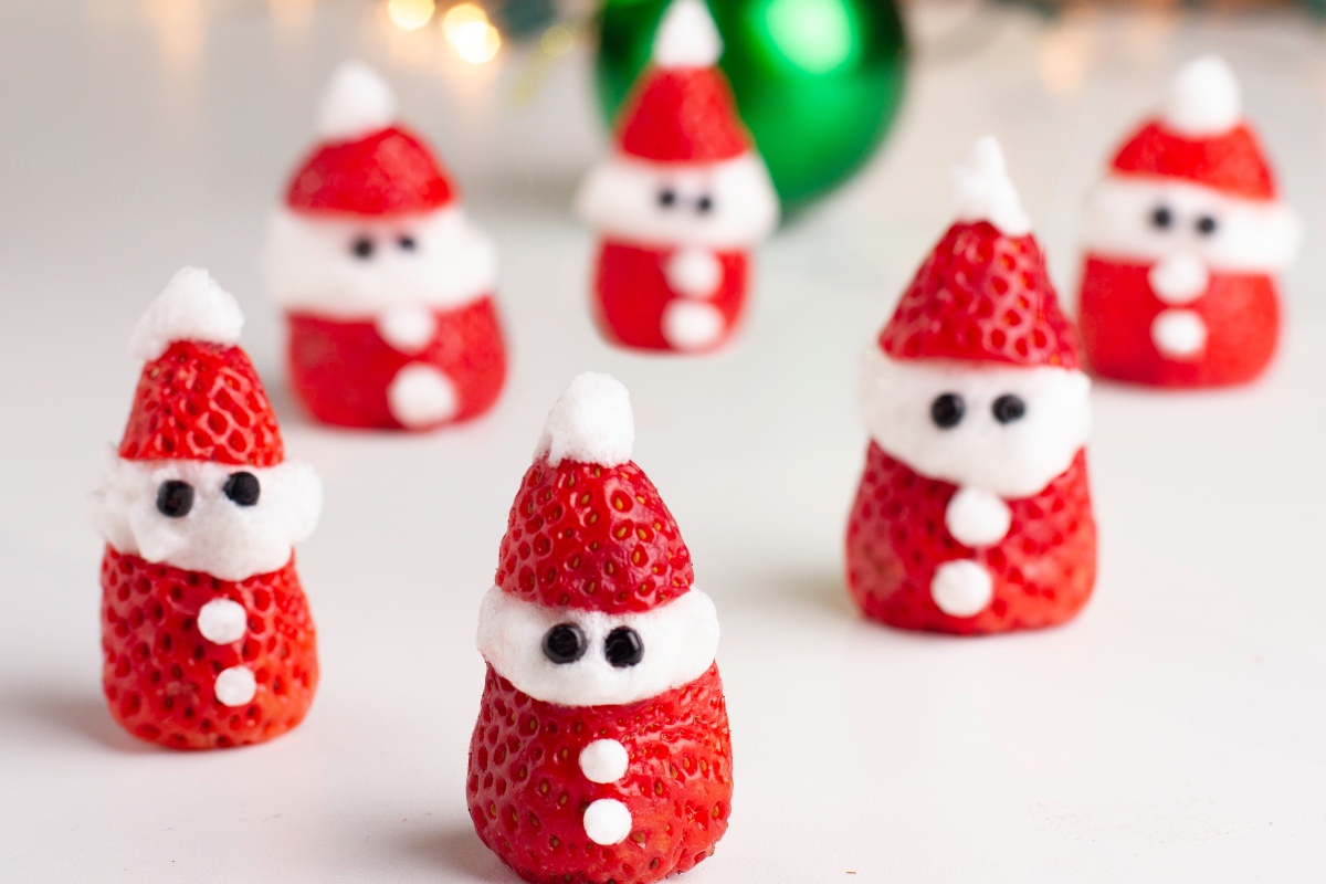 Strawberries decorated with cream like Santa Claus